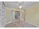 Neutral bedroom featuring french doors, chandelier, and built-in shelving at 6928 Shoals Way, Indianapolis, IN 46237