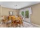 This dining room has wood floors, updated lighting, and french doors leading to the backyard at 6928 Shoals Way, Indianapolis, IN 46237
