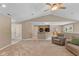 Open-concept living room leading to the kitchen with seating area at 6928 Shoals Way, Indianapolis, IN 46237