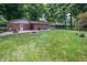 Expansive backyard with well-manicured lawn, fire pit, and privacy fencing offers ample space for recreation at 7224 N Tuxedo St, Indianapolis, IN 46240