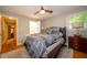 Comfortable bedroom offers neutral tones, soft lighting, and ample space for relaxation and rest at 7224 N Tuxedo St, Indianapolis, IN 46240