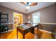 This office features hardwood floors, neutral walls and lots of natural light at 7224 N Tuxedo St, Indianapolis, IN 46240