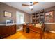 Bright office space with hardwood floors, and a ceiling fan at 7224 N Tuxedo St, Indianapolis, IN 46240