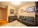 A small, cozy room with a couch and sports decor, great for watching the game at 7224 N Tuxedo St, Indianapolis, IN 46240