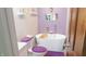 Spa-like bathroom featuring a freestanding tub, stylish fixtures, and modern design at 7326 Lowe Dr, Lawrence, IN 46226