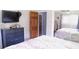 This is a cozy bedroom with mirrored closet doors and a wooden door at 7326 Lowe Dr, Lawrence, IN 46226