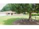 Landscaped front yard featuring lawn, decorative gnomes, and view of home's exterior with American flag at 7326 Lowe Dr, Lawrence, IN 46226