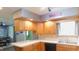 This is a cozy kitchen with ample wooden cabinet space and modern appliances at 7326 Lowe Dr, Lawrence, IN 46226