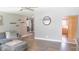 Spacious living room with modern decor, wood flooring, and open layout to other rooms at 7326 Lowe Dr, Lawrence, IN 46226