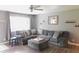 Comfortable living room with a large sectional sofa, neutral color palette, and wood-look flooring at 7326 Lowe Dr, Lawrence, IN 46226