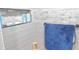 This is a shower with a niche and a blue towel rack at 7326 Lowe Dr, Lawrence, IN 46226