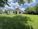 View of the backyard and a garden area on the side of the house at 7450 Cobblestone W Dr, Indianapolis, IN 46236