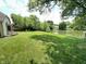 View of the backyard with a fence and view of the pond at 7450 Cobblestone W Dr, Indianapolis, IN 46236