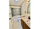 Bathroom featuring updated vanity, toilet and shower/tub combination with tiled surround at 7450 Cobblestone W Dr, Indianapolis, IN 46236