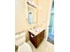 Compact bathroom with white toilet, tiled floor, modern vanity, and neutral walls for practical comfort at 7450 Cobblestone W Dr, Indianapolis, IN 46236