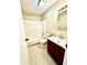 Bright bathroom with tiled floor, vanity, shower, and tub featuring white tiles and a coordinated design at 7450 Cobblestone W Dr, Indianapolis, IN 46236