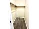 Walk-in closet with neutral walls and carpeting providing ample storage space for clothing and accessories at 7450 Cobblestone W Dr, Indianapolis, IN 46236