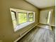 Inviting entryway with light gray vinyl flooring, bay window, and a welcoming front door at 7450 Cobblestone W Dr, Indianapolis, IN 46236