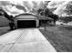 Charming single-story home with stone facade, attached garage, and well-manicured lawn at 7450 Cobblestone W Dr, Indianapolis, IN 46236