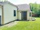 Side view of house with garden area and siding at 7450 Cobblestone W Dr, Indianapolis, IN 46236