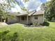 Stylish exterior featuring stone accents and a cozy covered porch at 7450 Cobblestone W Dr, Indianapolis, IN 46236