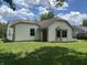 Exterior view of the house showing a garden area, siding, and window at 7450 Cobblestone W Dr, Indianapolis, IN 46236