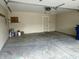 Spacious garage with ample room for parking and storage, featuring a sealed concrete floor at 7450 Cobblestone W Dr, Indianapolis, IN 46236