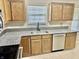 Kitchen with granite countertops, wood cabinets, stainless steel sink and tiled backsplash at 7450 Cobblestone W Dr, Indianapolis, IN 46236
