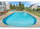 Refreshing in-ground pool surrounded by lounge chairs in a serene backyard setting at 7830 Cross Creek, Avon, IN 46123