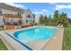 Backyard features sparkling pool, covered patio, and plenty of seating space at 7830 Cross Creek, Avon, IN 46123