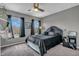 A cozy bedroom with a black comforter, hanging chair, and natural light at 7830 Cross Creek, Avon, IN 46123