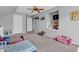 Bedroom with lots of toys, carpeted floors, and closet with a TV at 7830 Cross Creek, Avon, IN 46123