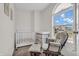 A cute Bedroom with a crib, comfy chair, ottoman, and plenty of natural light at 7830 Cross Creek, Avon, IN 46123