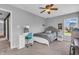 Well-lit bedroom with a desk, modern chair, and neutral decor at 7830 Cross Creek, Avon, IN 46123