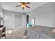 Bright bedroom with neutral walls, gray bedding, carpet, and two closets at 7830 Cross Creek, Avon, IN 46123
