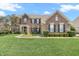 Beautiful brick home featuring a well-maintained lawn and tasteful landscaping at 7830 Cross Creek, Avon, IN 46123