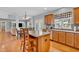 Bright kitchen featuring an island, stainless steel appliances, and seamless flow into the dining area at 7830 Cross Creek, Avon, IN 46123