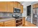 Modern kitchen with stainless steel appliances and light wood cabinetry with a double oven at 7830 Cross Creek, Avon, IN 46123