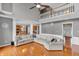 Open floor plan with hardwood floors connecting the living room, dining area, and kitchen at 7830 Cross Creek, Avon, IN 46123