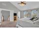 Spacious bedroom with a TV and electric fireplace next to the doorway at 7830 Cross Creek, Avon, IN 46123