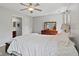 Light-filled bedroom with a ceiling fan, a dresser, and a window at 882 Lincoln Park W Dr, Greenwood, IN 46142