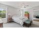 Bright bedroom featuring gray walls, carpet, and a ceiling fan at 882 Lincoln Park W Dr, Greenwood, IN 46142