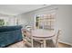 Bright dining area features wood floors, a round table, and a large window at 882 Lincoln Park W Dr, Greenwood, IN 46142