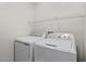 Laundry room with a washer and dryer and overhead shelf at 882 Lincoln Park W Dr, Greenwood, IN 46142
