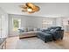 Open-concept living room with comfortable seating, a ceiling fan, and natural light at 882 Lincoln Park W Dr, Greenwood, IN 46142
