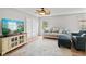 Bright living room features comfortable seating, a ceiling fan, and natural light at 882 Lincoln Park W Dr, Greenwood, IN 46142