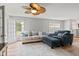 Open-concept living room with comfortable seating, a ceiling fan, and natural light at 882 Lincoln Park W Dr, Greenwood, IN 46142