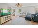 Bright living room features comfortable seating, a ceiling fan, and natural light at 882 Lincoln Park W Dr, Greenwood, IN 46142