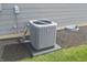 Side view of an outdoor air conditioning unit with mulched landscape at 10166 Ranford Blvd, Fishers, IN 46040