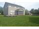 Large backyard with a patio and screened-in porch, perfect for outdoor entertaining at 10166 Ranford Blvd, Fishers, IN 46040
